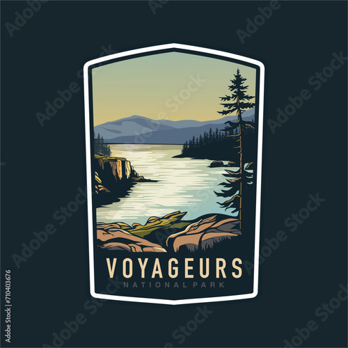 Emblem sticker patch logo illustration of Voyageurs National Park on dark background, lake and canoe vector badge