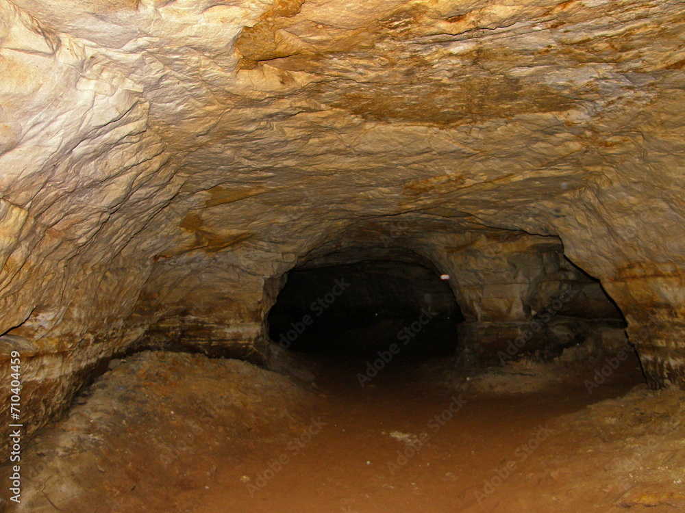Obraz premium Tourist attraction. Sablinsky caves, ancient abandoned caves for the extraction of quartz sand. Leningrad region, Russia.