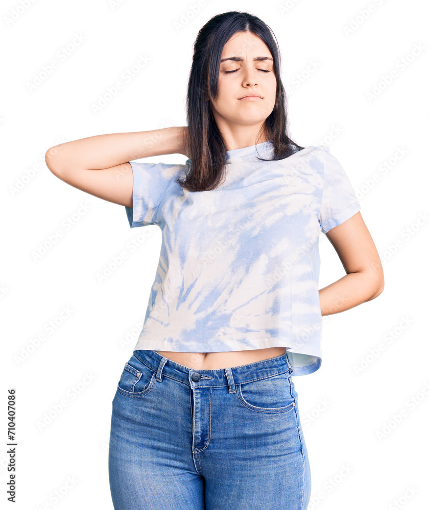Young beautiful girl wearing casual t shirt suffering of neck ache injury, touching neck with hand, muscular pain Young beautiful girl wearing casual t shirt suffering of neck ache injury, touching neck with hand, muscular pain