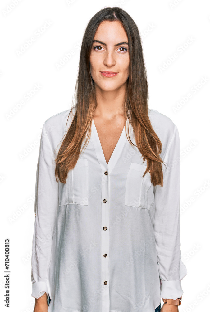 Young beautiful woman wearing casual clothes relaxed with serious expression on face. simple and natural looking at the camera. Young beautiful woman wearing casual clothes relaxed with serious expression on face. simple and natural looking at the camera.