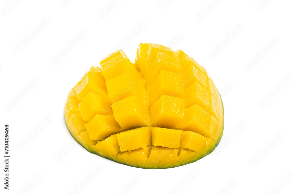 Cut into cubes fresh organic green mango delicious fruit side view isolated on white background clipping path