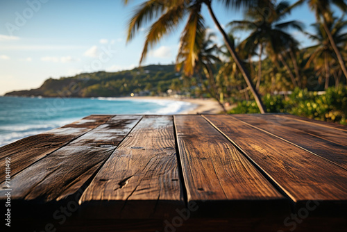 Wooden table top on blur tropical beach background - can be used for display or montage your products. 