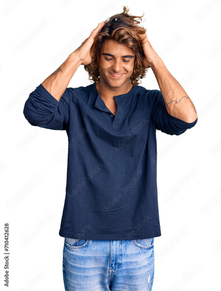 Young hispanic man wearing casual clothes suffering from headache desperate and stressed because pain and migraine. hands on head. Young hispanic man wearing casual clothes suffering from headache desperate and stressed because pain and migraine. hands on head.