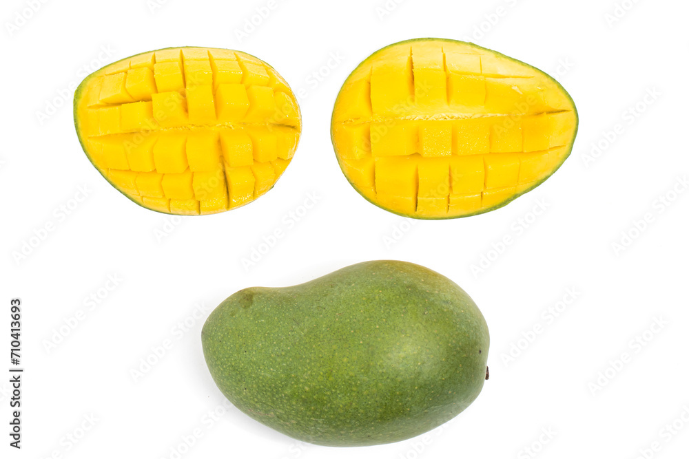 Two sliced cut into cubes and whole fresh organic green mango delicious fruit flat lay face photo concept isolated on white background clipping path
