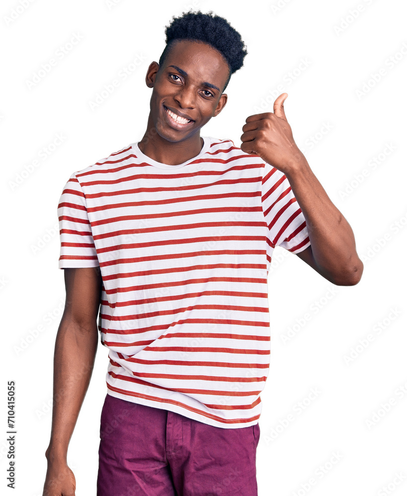 Young african american man wearing casual clothes doing happy thumbs up gesture with hand. approving expression looking at the camera showing success. Young african american man wearing casual clothes doing happy thumbs up gesture with hand. approving expression looking at the camera showing success.