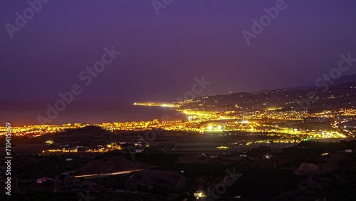 Time Lapse City Dusk, Cars Lights moving at panoramic sea bay with sunset sky photo