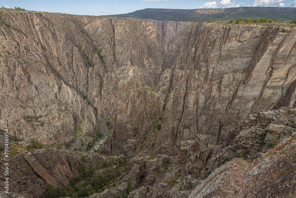 Vertical walls of the north and the south rim in the Black Canyon of the Gunnison seen from Island Peaks View View on the north rim