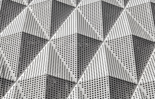 Finishing of the building with modern materials from an aluminum facade. Fragment of a modern office building. Part of the facade of a skyscraper with metal diamond-shaped grilles.