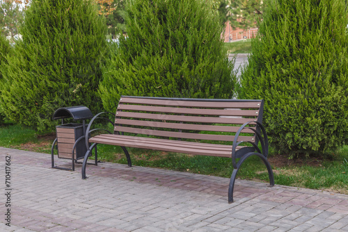 Wooden vintage bench in a public park.