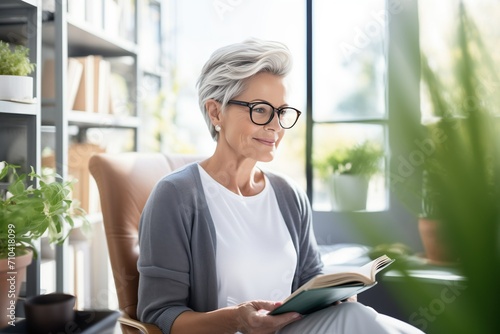 Free Download Mature psychologist woman conducts therapy consultations in her office, taking notes in her notebook - GFXLoad