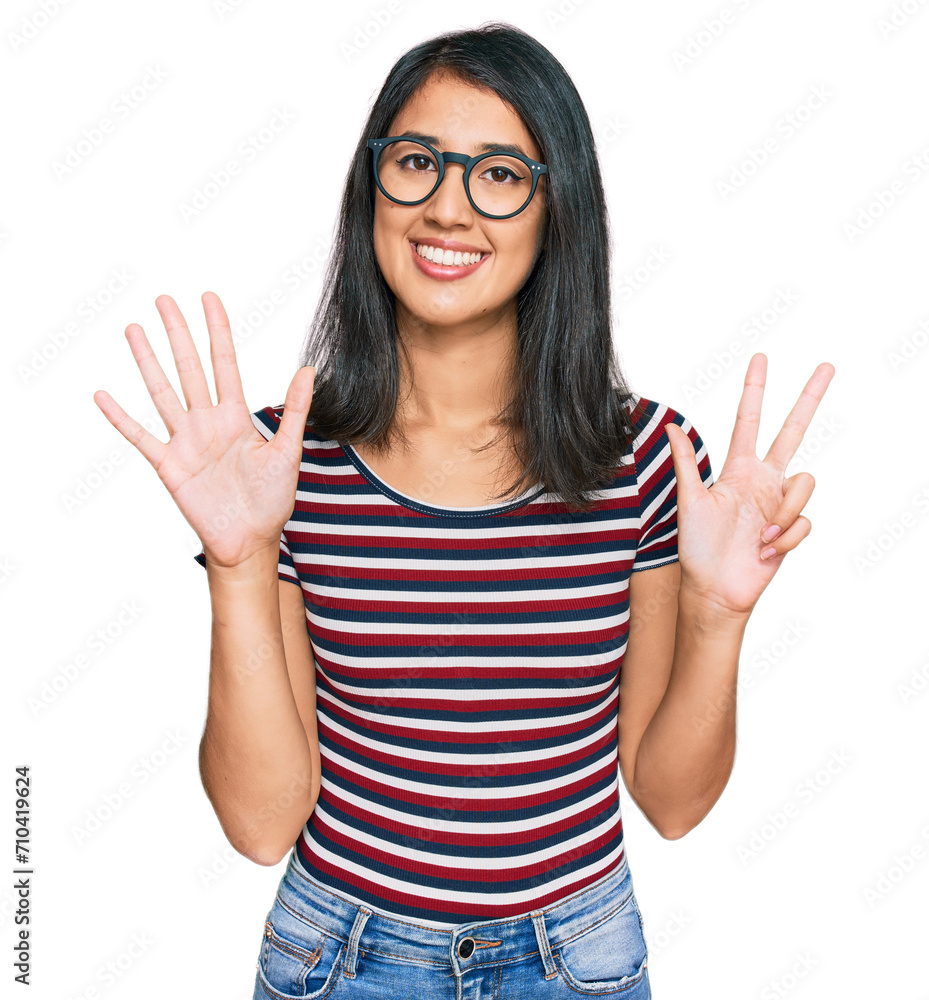 Beautiful asian young woman wearing casual clothes and glasses showing and pointing up with fingers number eight while smiling confident and happy. Beautiful asian young woman wearing casual clothes and glasses showing and pointing up with fingers number eight while smiling confident and happy.
