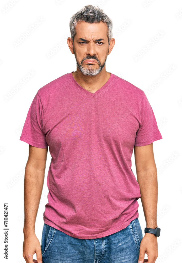 Middle age grey-haired man wearing casual clothes depressed and worry for distress, crying angry and afraid. sad expression. Middle age grey-haired man wearing casual clothes depressed and worry for distress, crying angry and afraid. sad expression.