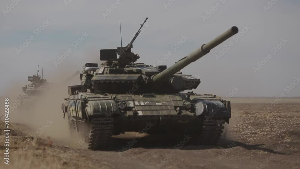 Tanks of the Ukrainian army drive along a field road Tanks of the Ukrainian army drive along a field road