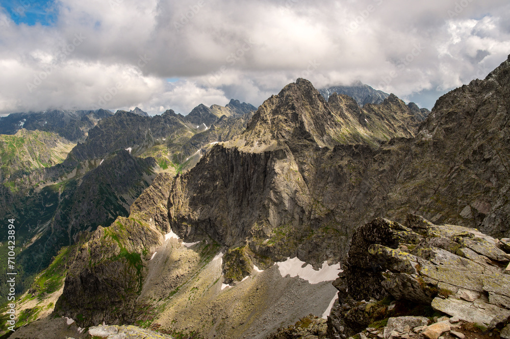 Beautiful landscape of amazing mountains and rocks with dramatic sky near Rysy mountain in High Tatras, Slovakia. 