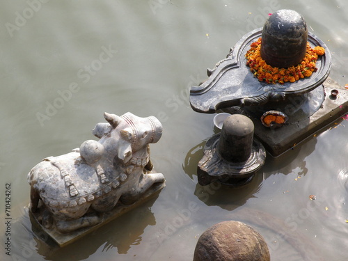 Shiv Lingam With Nandi, Bull in River Ganges in Varanasi, India photo