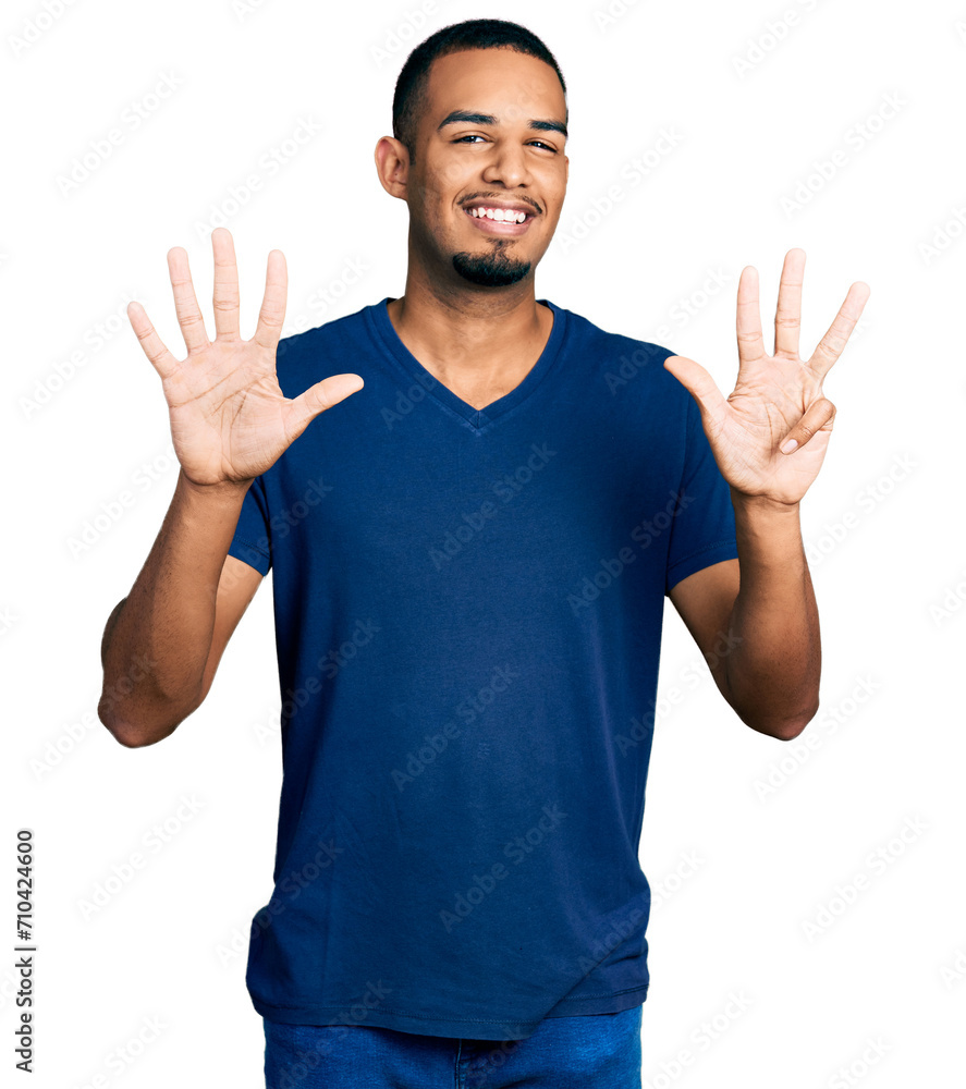 Young african american man wearing casual t shirt showing and pointing up with fingers number nine while smiling confident and happy. Young african american man wearing casual t shirt showing and pointing up with fingers number nine while smiling confident and happy.