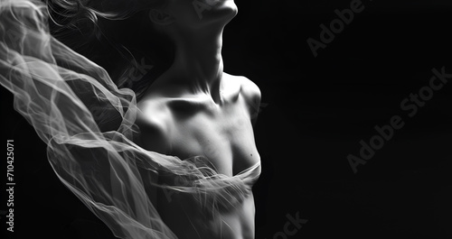Fashion editorial Concept. Closeup Sensual portrait silhouette of beautiful woman beautiful body form wrapped with silk. illuminated dynamic composition dramatic lighting. copy space	

