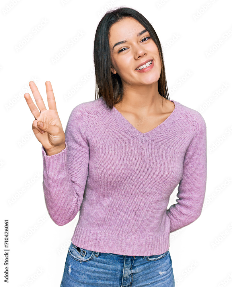 Young hispanic girl wearing casual clothes showing and pointing up with fingers number three while smiling confident and happy. Young hispanic girl wearing casual clothes showing and pointing up with fingers number three while smiling confident and happy.