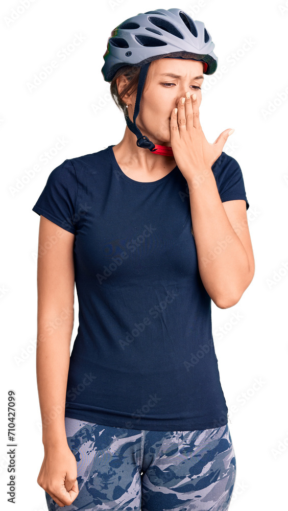 Beautiful caucasian woman wearing bike helmet bored yawning tired covering mouth with hand. restless and sleepiness. Beautiful caucasian woman wearing bike helmet bored yawning tired covering mouth with hand. restless and sleepiness.