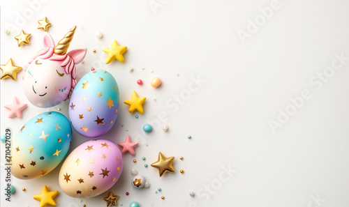Unicorn shaped Easter eggs colorful with gold pattern on white background. Top view, space for text.