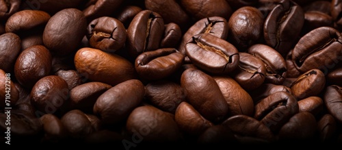 Close up view of aromatic hot roasted coffee beans with smoke. Generate AI image
