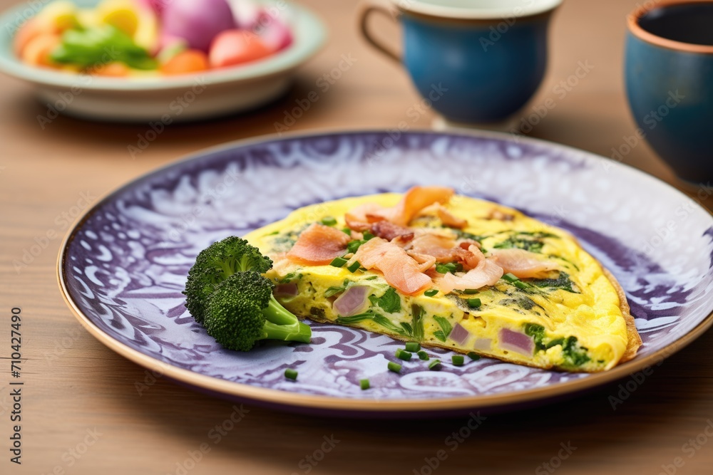 folded omelette with broccoli and red onion on a ceramic plate folded omelette with broccoli and red onion on a ceramic plate
