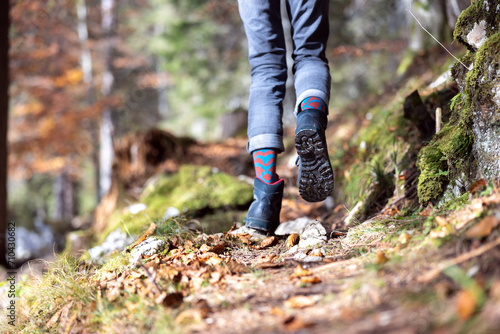 Female Legs Close up While Hiking in an Autumn Forest Wearing Hiking Boots