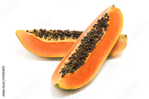 Two sliced fresh organic papaya delicious fruit side view isolated on white background clipping path