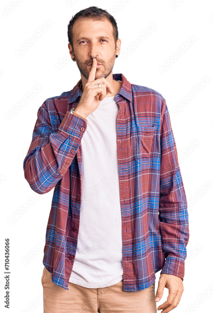 Young handsome man wearing casual clothes asking to be quiet with finger on lips. silence and secret concept. Young handsome man wearing casual clothes asking to be quiet with finger on lips. silence and secret concept.
