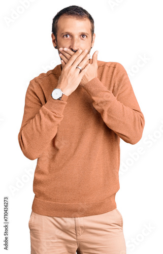 Young handsome man wearing casual clothes shocked covering mouth with hands for mistake. secret concept.