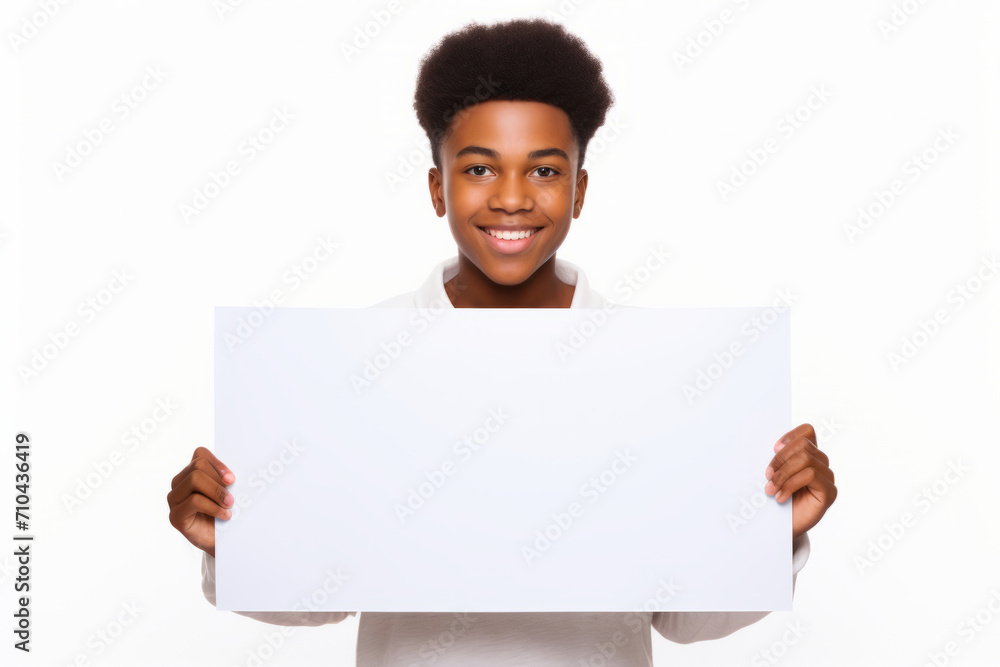 Happy black scholl girl holding blank white banner sign, isolated studio portrait. Happy black scholl girl holding blank white banner sign, isolated studio portrait.