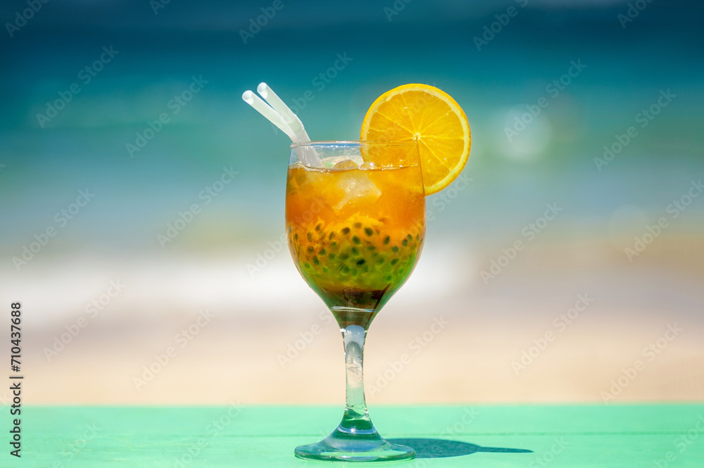 Cocktail on the beach, ocean in the background. relaxing holiday concept. Cocktail on the beach, ocean in the background. relaxing holiday concept.