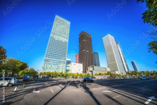 Wide Urban Road Leading to Glass Skyscrapers