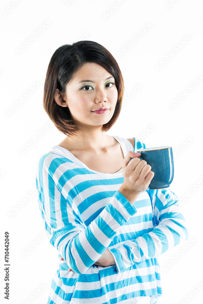 Happy Chinese woman holding a mug. Happy Chinese woman holding a mug.