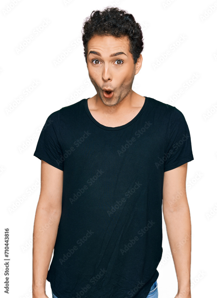 Young handsome man wearing casual black t shirt afraid and shocked with surprise expression, fear and excited face. Young handsome man wearing casual black t shirt afraid and shocked with surprise expression, fear and excited face.
