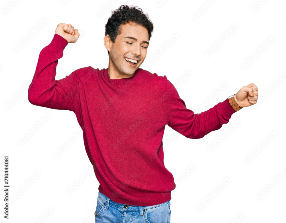 Young handsome man wearing casual clothes dancing happy and cheerful, smiling moving casual and confident listening to music Young handsome man wearing casual clothes dancing happy and cheerful, smiling moving casual and confident listening to music