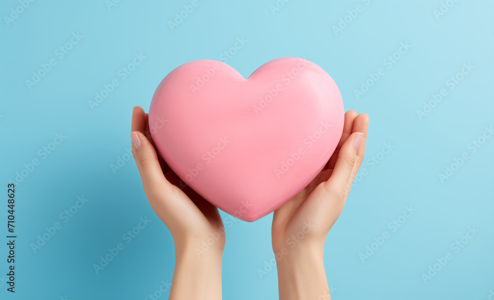heart in hand on a blue background, pink, blue heart in hand on a blue background, pink, blue