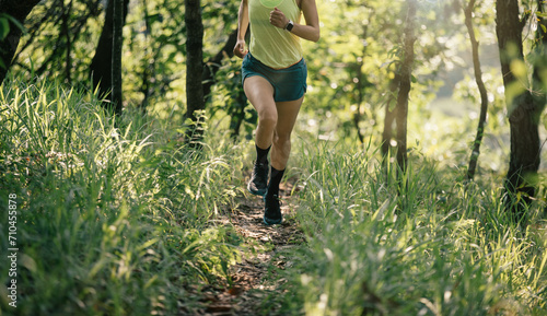 Photography Woman trail runner running at tropical forest mountain peak