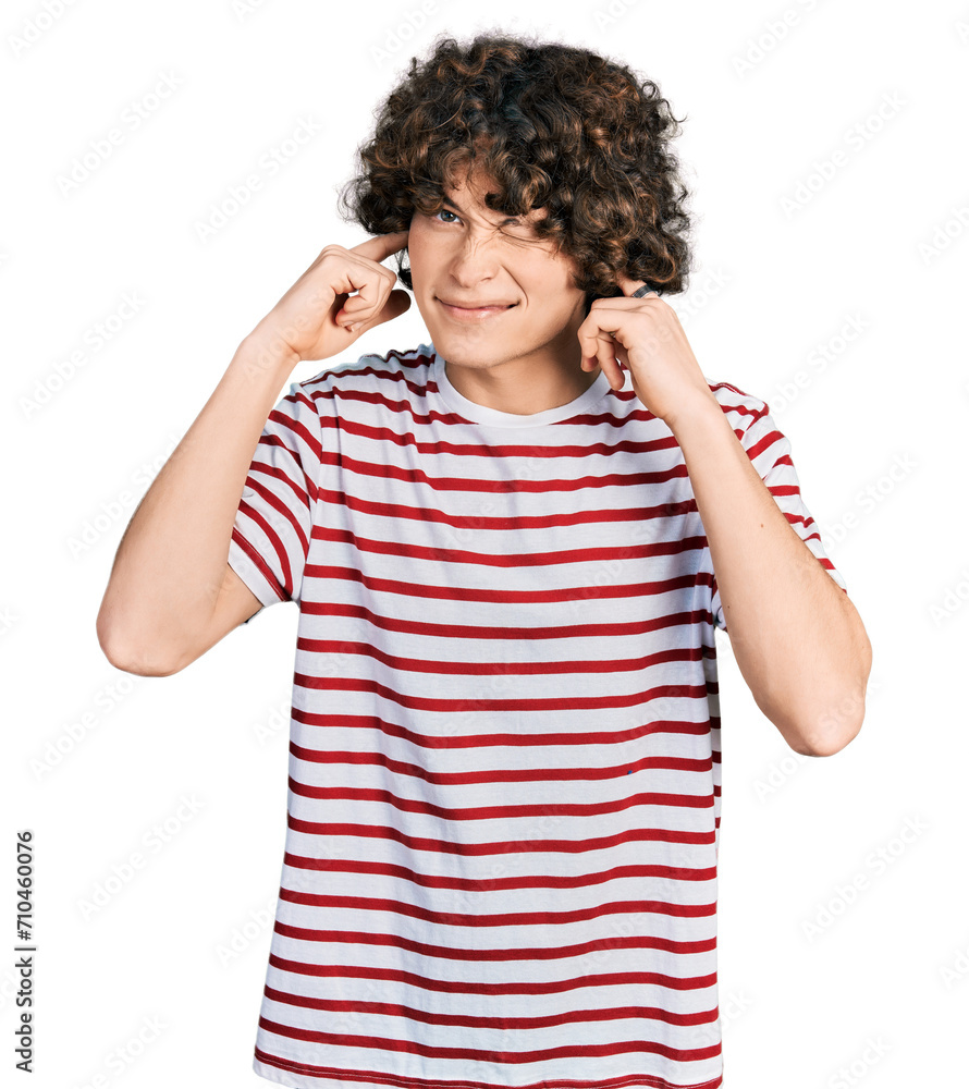 Caucasian teenager wearing casual clothes covering ears with fingers with annoyed expression for the noise of loud music. deaf concept. Caucasian teenager wearing casual clothes covering ears with fingers with annoyed expression for the noise of loud music. deaf concept.