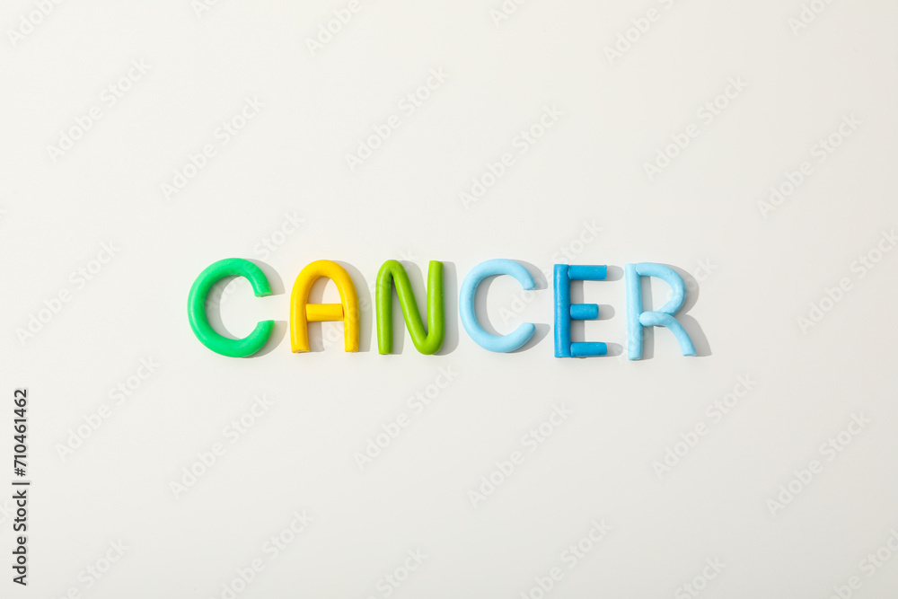 The inscription Cancer in colorful letters on a white background