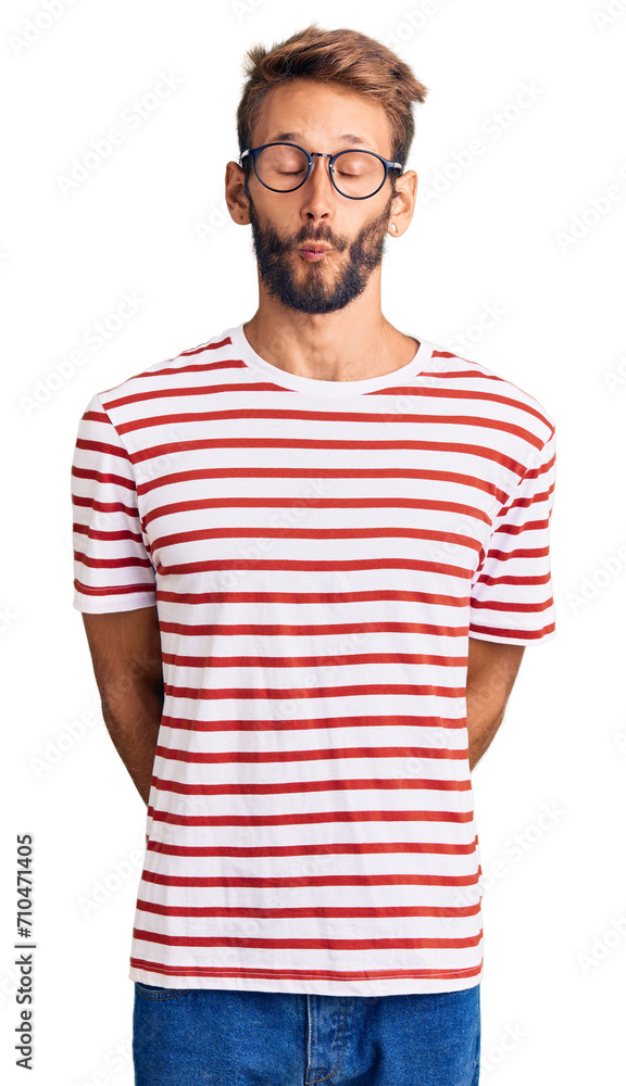 Handsome blond man with beard wearing casual clothes and glasses making fish face with lips, crazy and comical gesture. funny expression. Handsome blond man with beard wearing casual clothes and glasses making fish face with lips, crazy and comical gesture. funny expression.