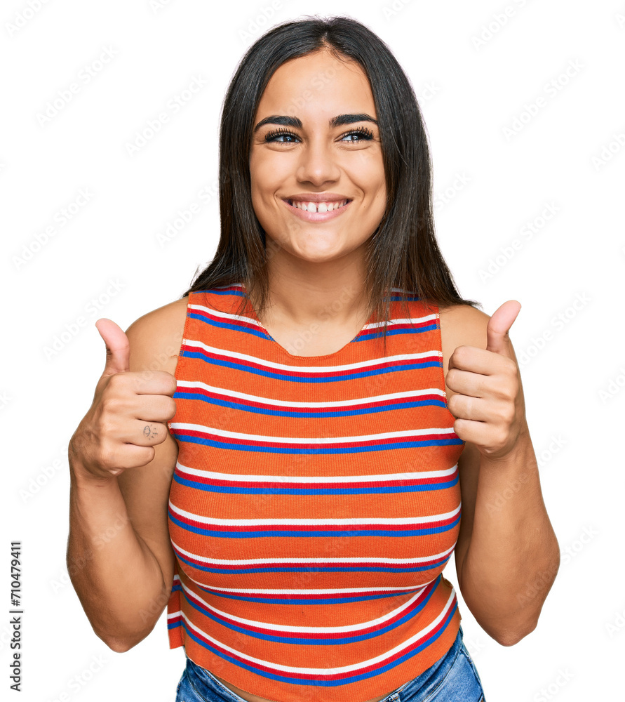 Young brunette woman wearing casual clothes success sign doing positive gesture with hand, thumbs up smiling and happy. cheerful expression and winner gesture. Young brunette woman wearing casual clothes success sign doing positive gesture with hand, thumbs up smiling and happy. cheerful expression and winner gesture.