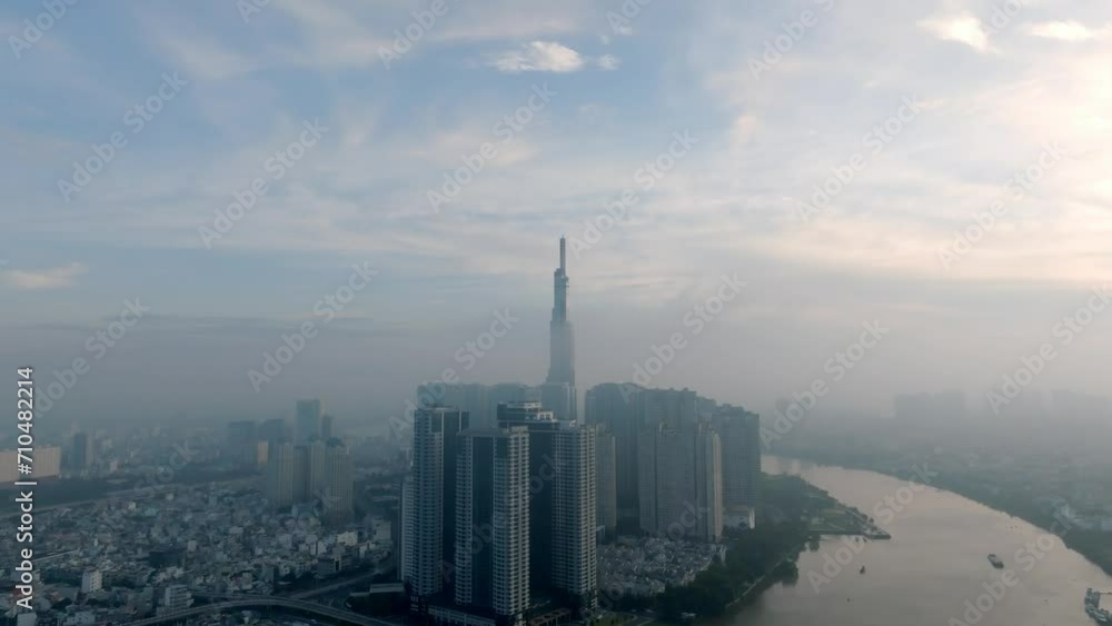 Aerial Shot Of Buildings In City Against Sky During Sunrise, Drone Flying Forward Over Cityscape - Ho Chi Minh City, Vietnam - stock video Aerial Shot Of Buildings In City Against Sky During Sunrise, Drone Flying Forward Over Cityscape - Ho Chi Minh City, Vietnam - stock video