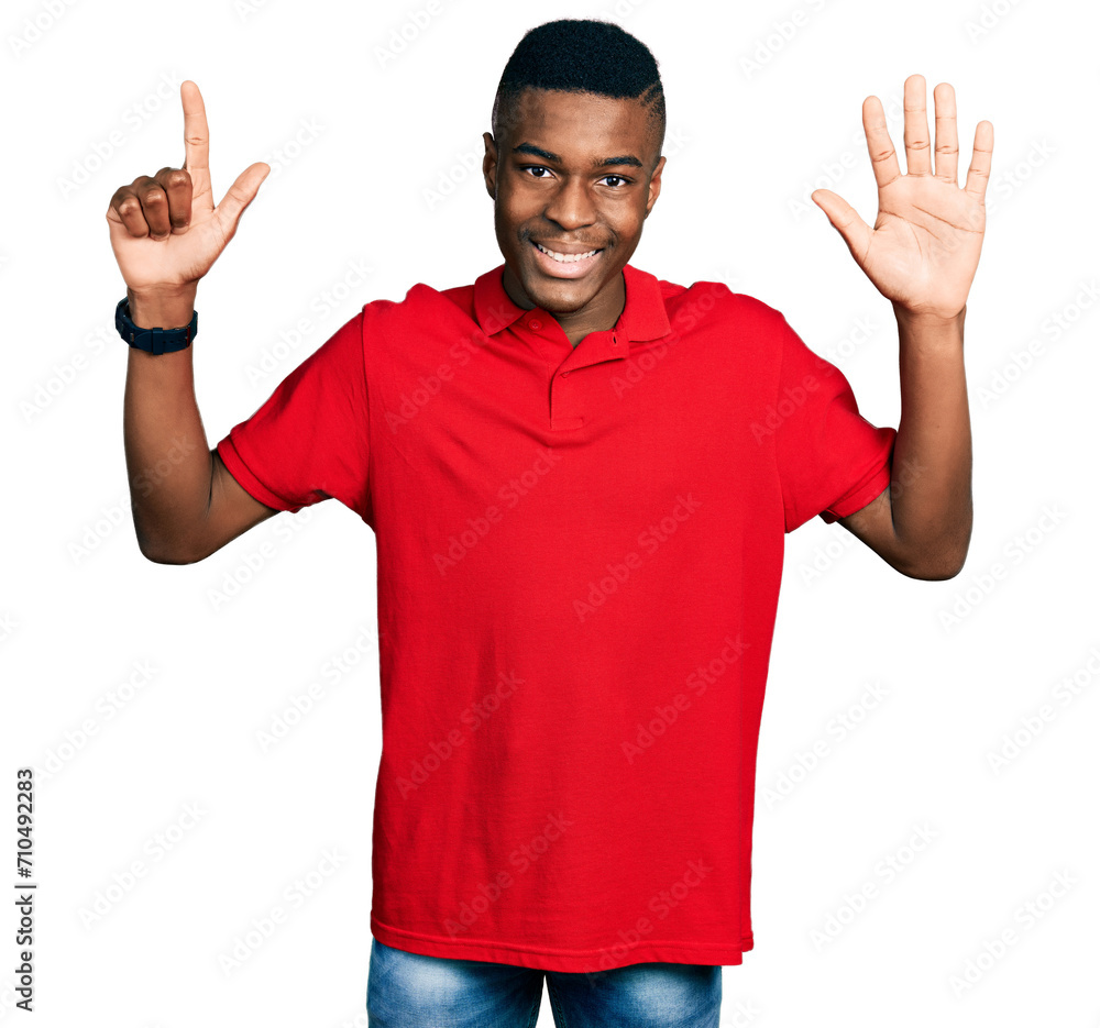 Young african american man wearing casual red t shirt showing and pointing up with fingers number seven while smiling confident and happy. Young african american man wearing casual red t shirt showing and pointing up with fingers number seven while smiling confident and happy.