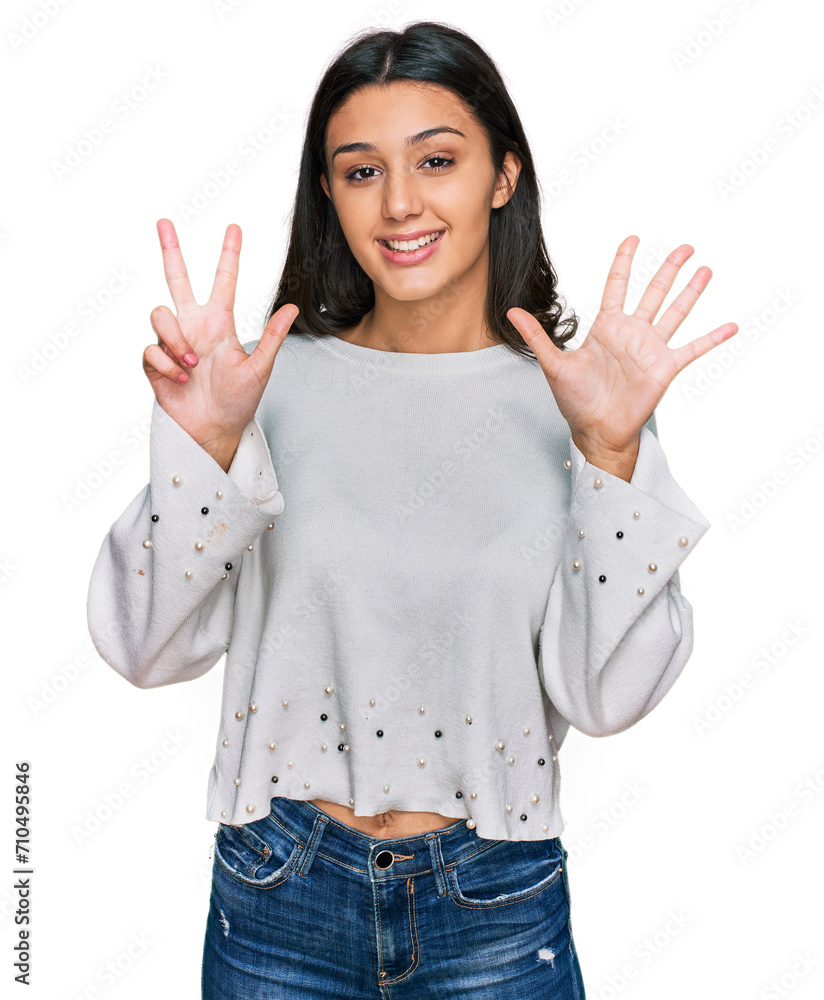 Young hispanic girl wearing casual clothes showing and pointing up with fingers number eight while smiling confident and happy. Young hispanic girl wearing casual clothes showing and pointing up with fingers number eight while smiling confident and happy.