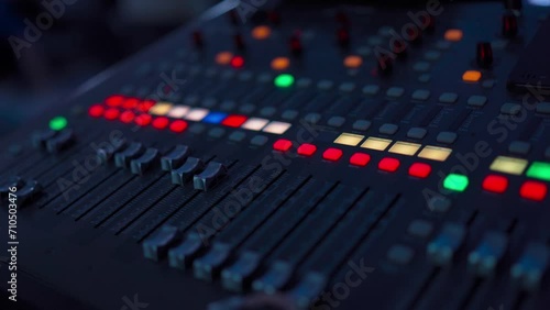 Professional audio mixing console. ​Mixer. Pro audio mixing board faders and knobs. Static shot of multi-track music recording equipment faders and sliders.	
 photo