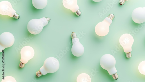 Background of white led light bulbs with glowing light bulbs on light blue backdrop. Ecology, save energy, environment and creative and idea concept. Fat lay photo