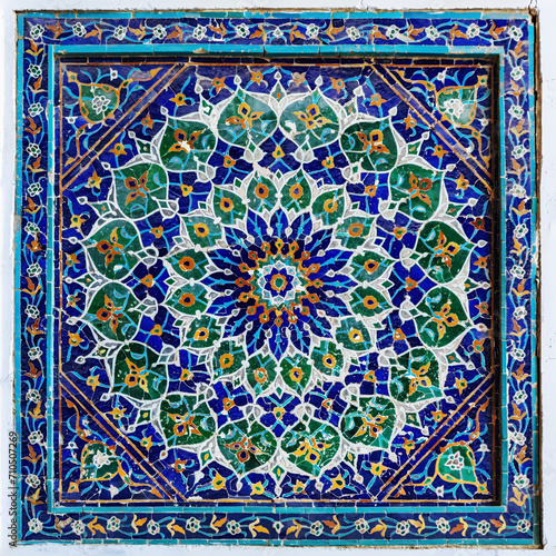 Traditional Uzbek circular pattern on the ceramic tile on the wall of the madrasah. Samarkand, Uzbekistan