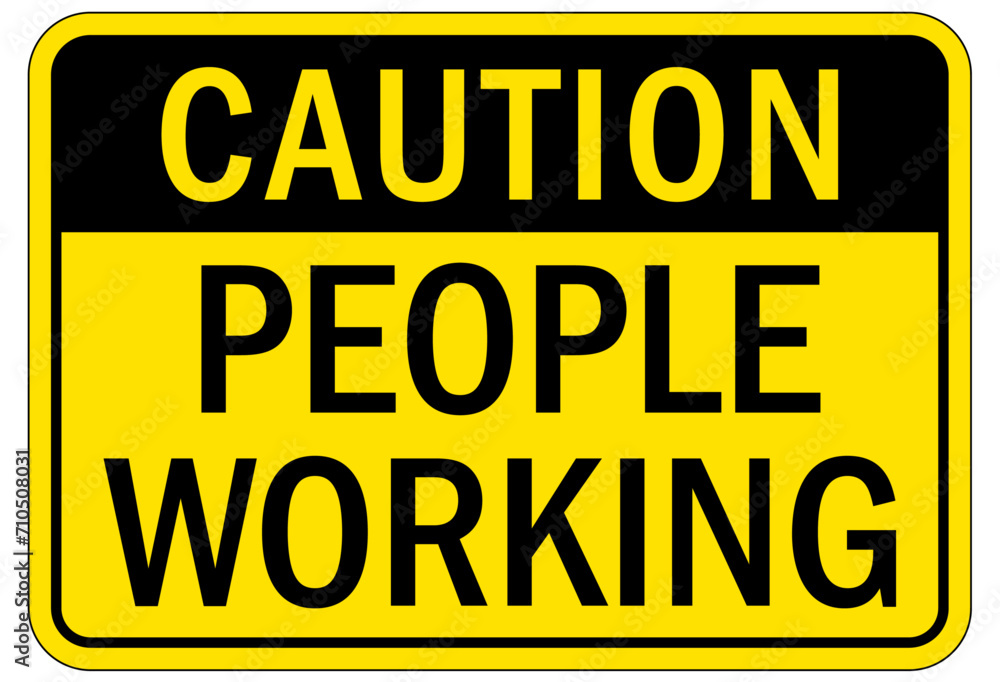 Men working above warning sign and labels Men working above warning sign and labels
