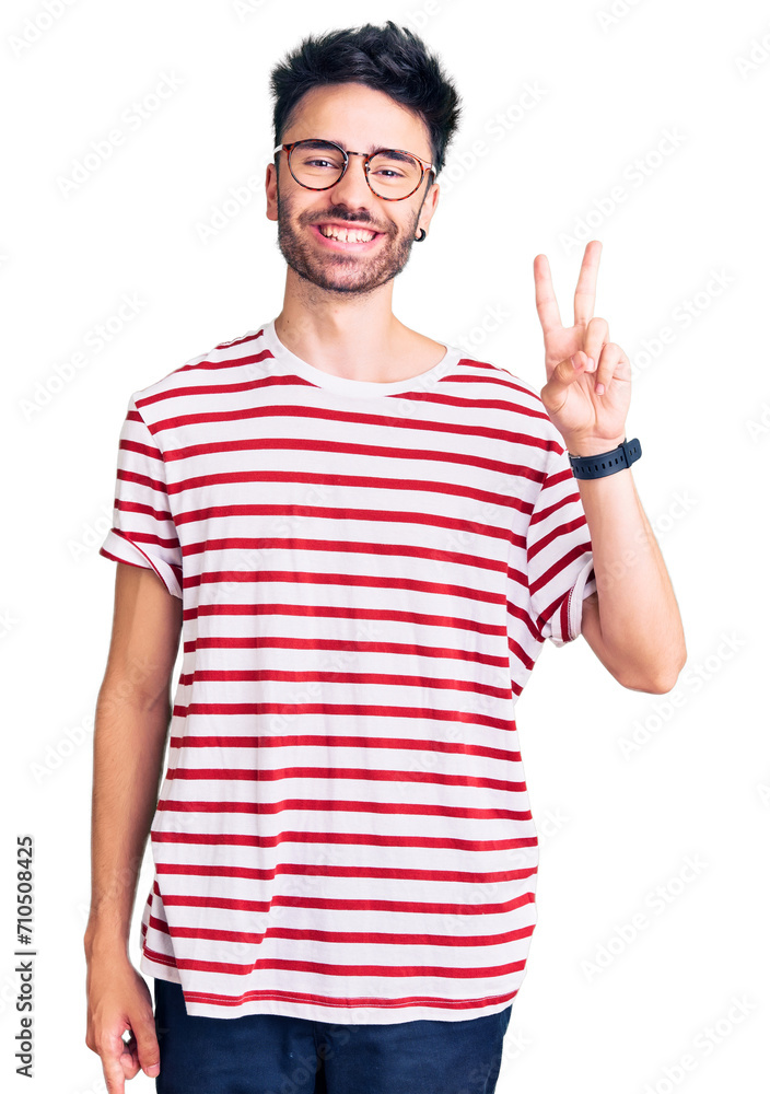 Young hispanic man wearing casual clothes showing and pointing up with fingers number two while smiling confident and happy. Young hispanic man wearing casual clothes showing and pointing up with fingers number two while smiling confident and happy.